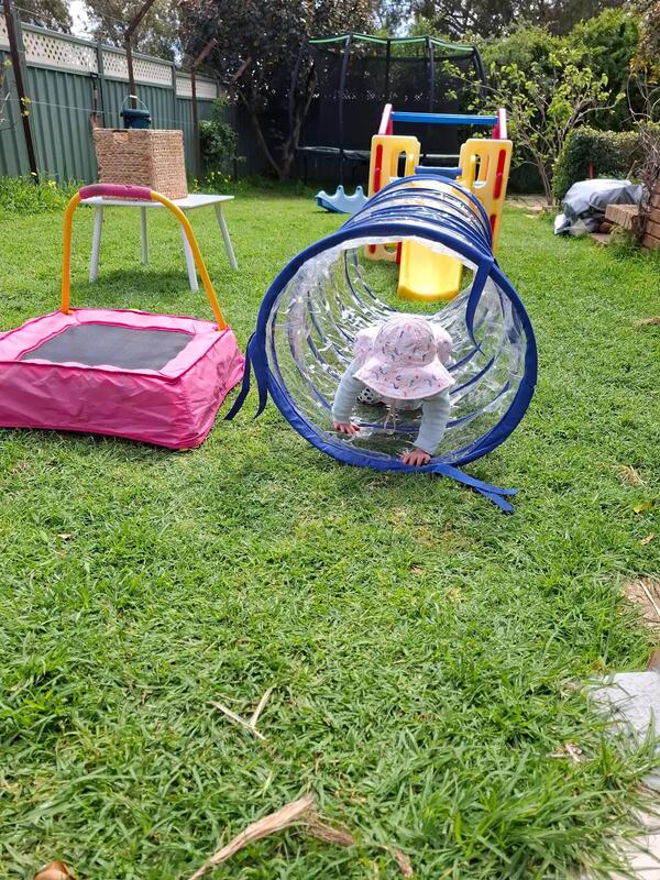 Child exploring outdoors in nature at family day care the Perth Hills, WA