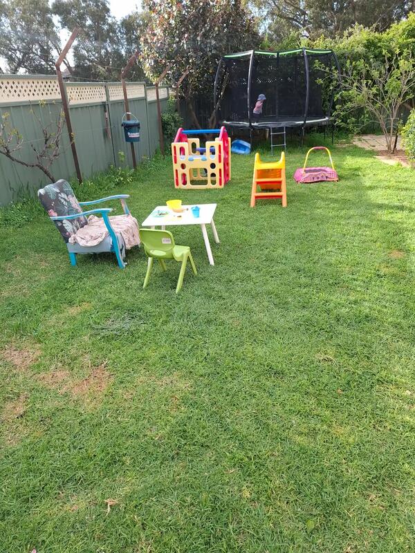 Outdoor play area at Aunty Joy's Place family day care Perth Hills - trampoline, tunnel and slide