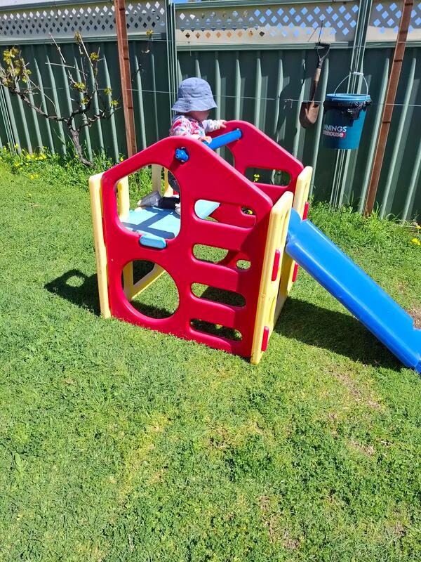Child playing on slide at Aunty Joy's Place family day care in the Perth Hills Western Australia