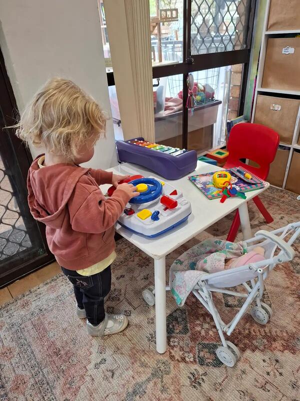 Child engaged in play with educational toys at family day care the Perth Hills, WA